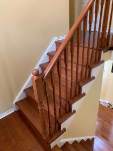 Finished product of the new stained hardwood staircase, second level